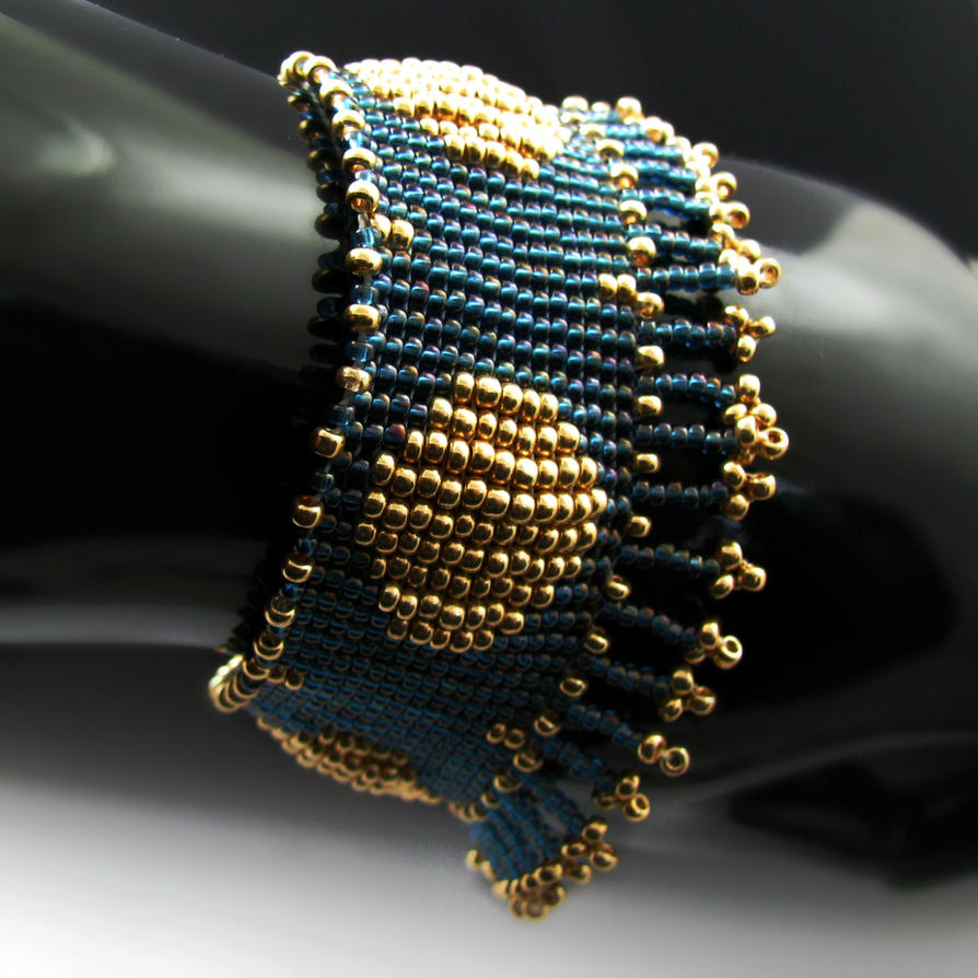 Blue and golden bead loomed bracelet with fringe by CatsWire on DeviantArt